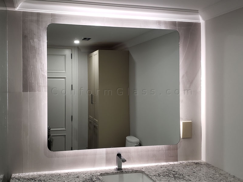 Mirror with LED light and rounded corners
